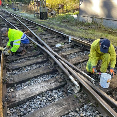 a person sitting on a train track