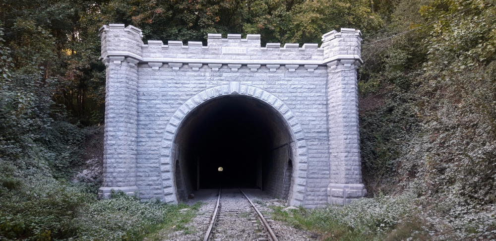a stone path in front of a brick building