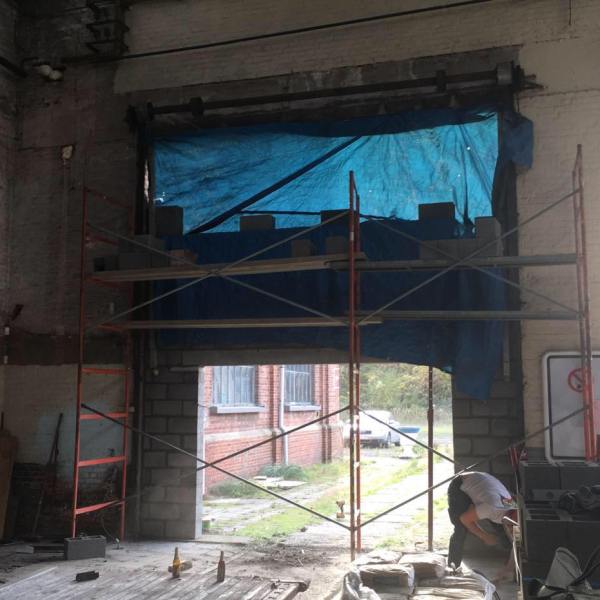 a building next to a fireplace