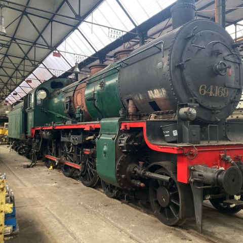 a person sitting at a train station