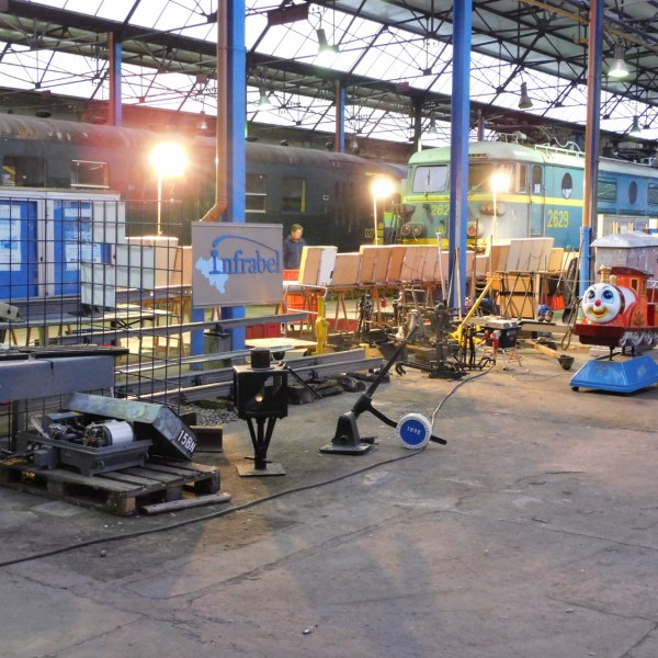 a group of people sitting at a bus stop