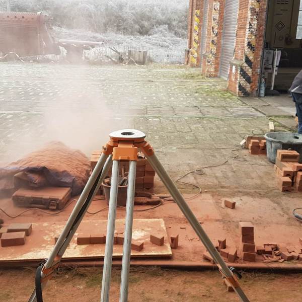 a man sitting on a tripod