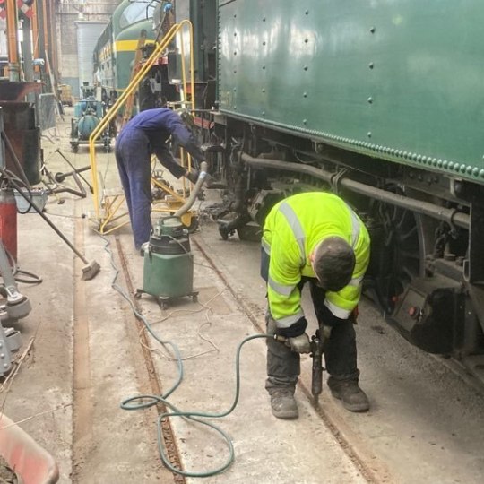 a man standing on a sidewalk