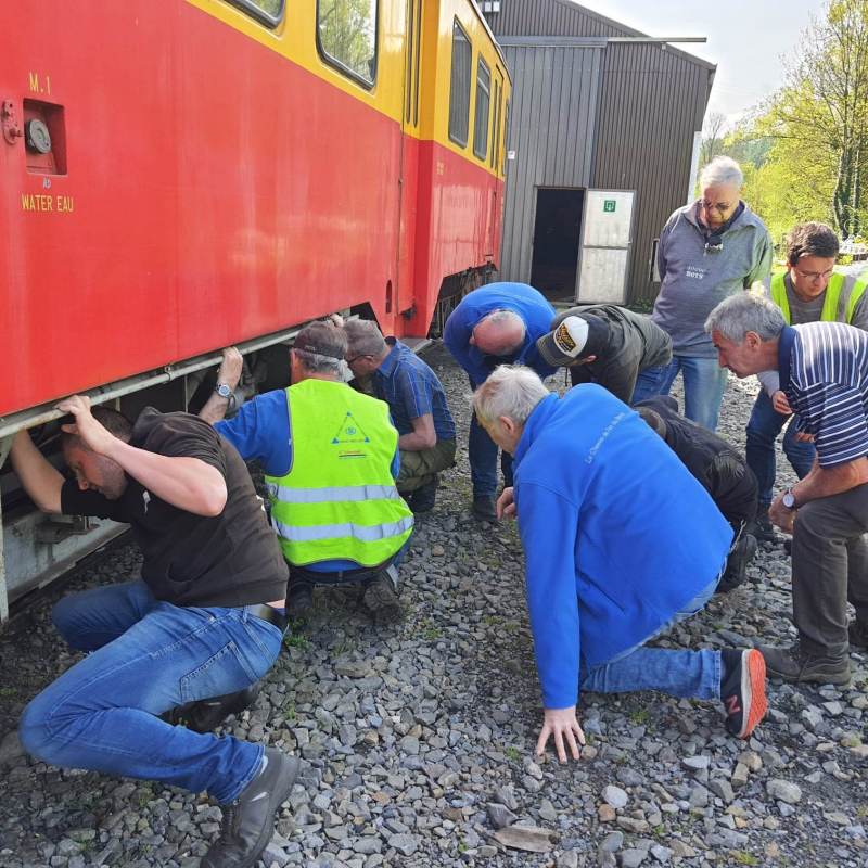 a group of people sitting at a train station