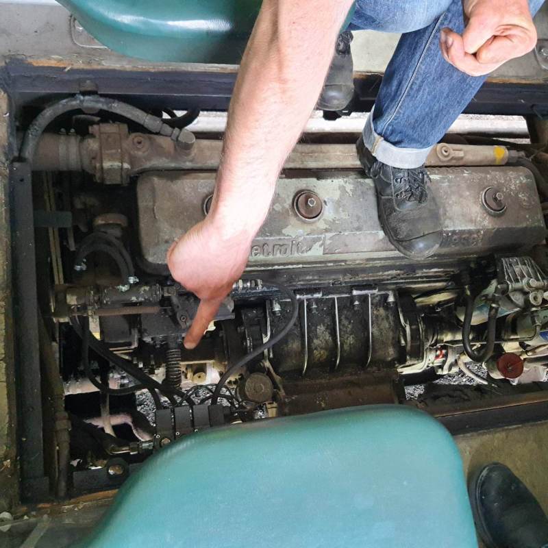 a person sitting in a car engine