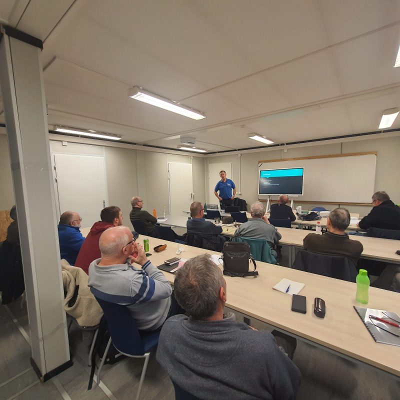a group of people sitting at a table in a room