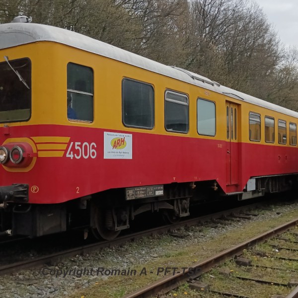 a passenger train that is sitting on a track