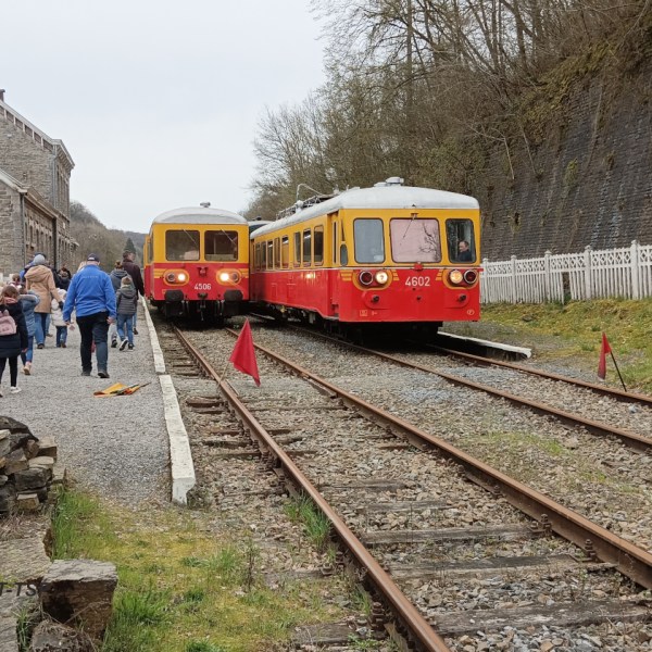 a group of people on a train track