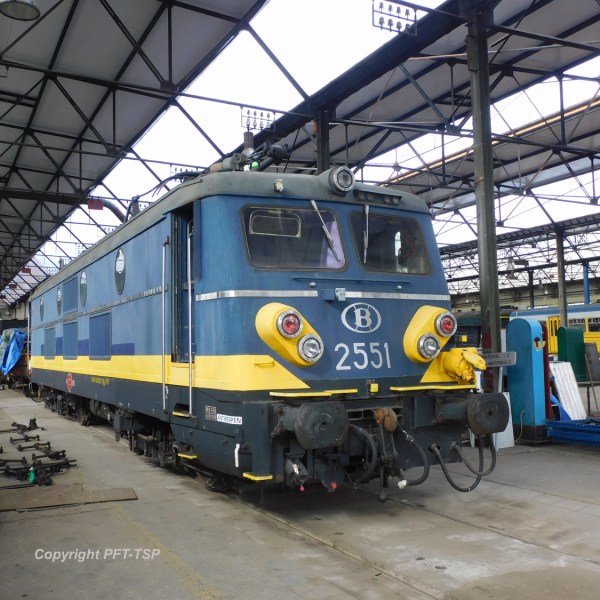 a passenger train pulling into a station