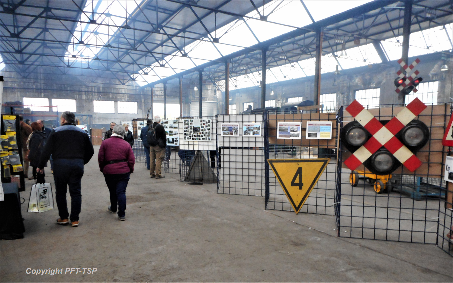 a group of people standing in a train station