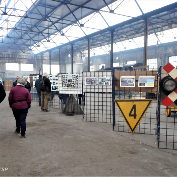 a group of people standing in a train station