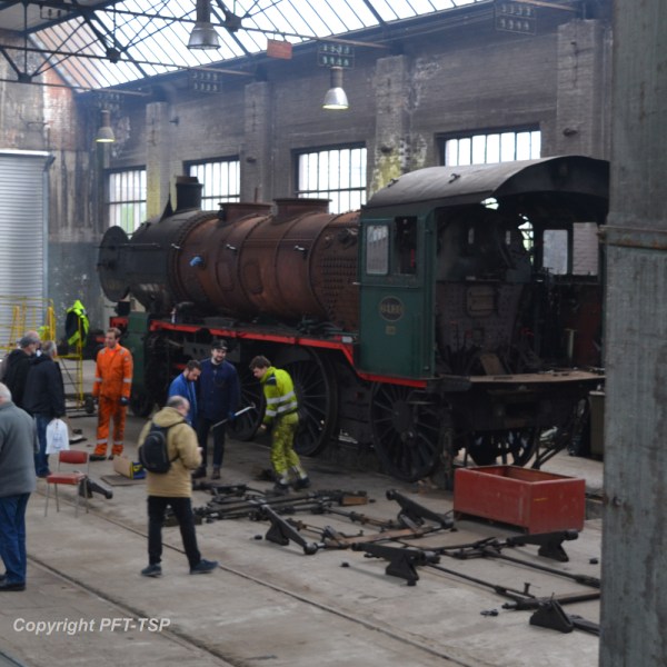 a group of people sitting at a train station