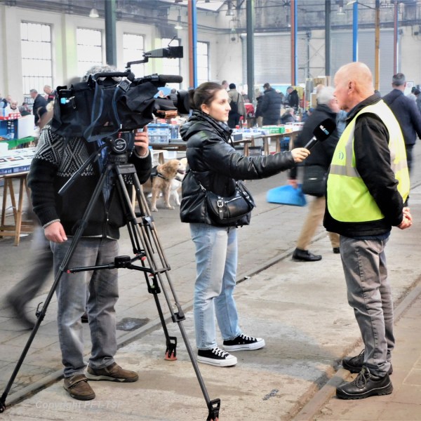 a group of people on a sidewalk