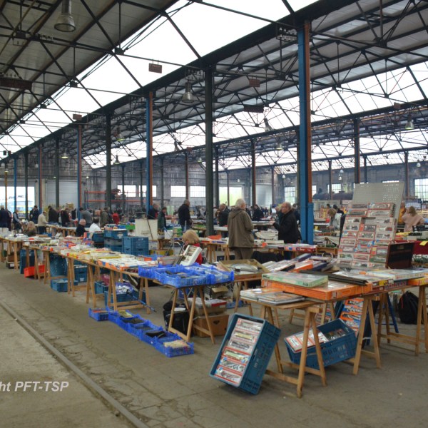 a group of people sitting at a train station