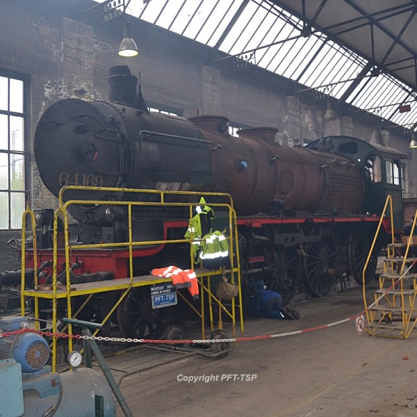 a group of people sitting at a train station