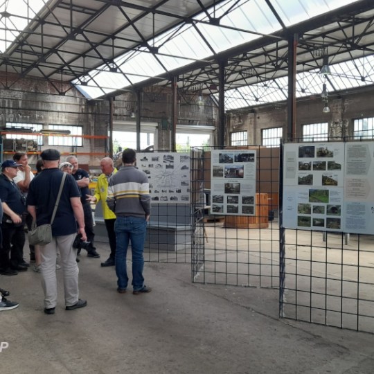 a group of people standing in front of a building