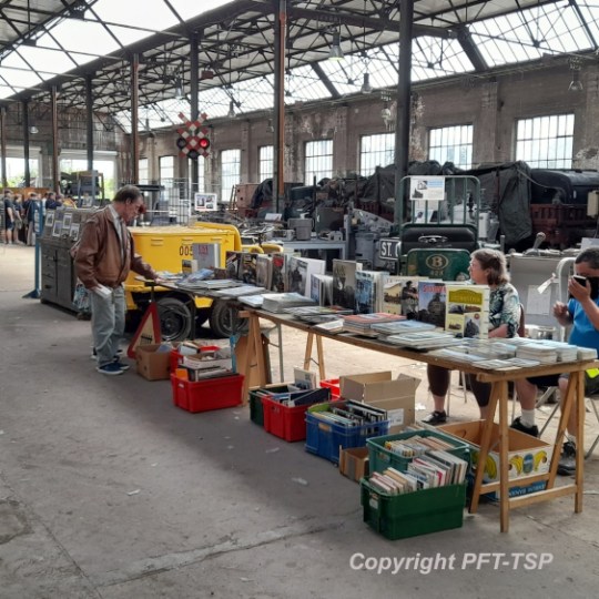 a group of people sitting at a train station