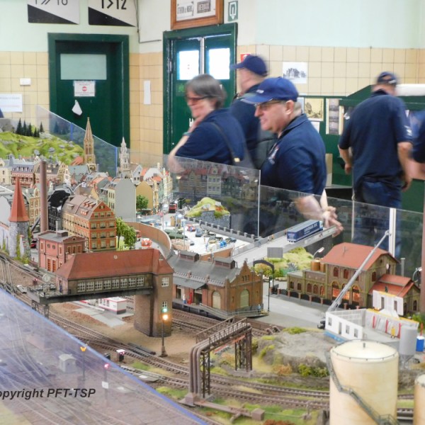 a group of people standing around a counter in a store