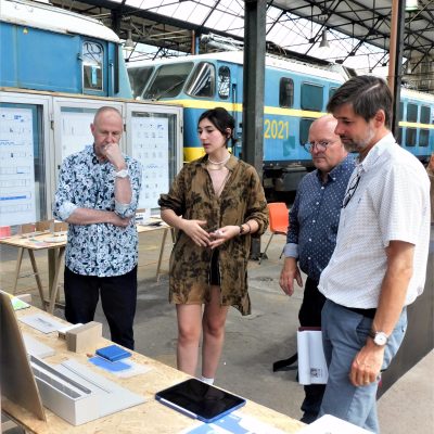a group of people standing in front of a building