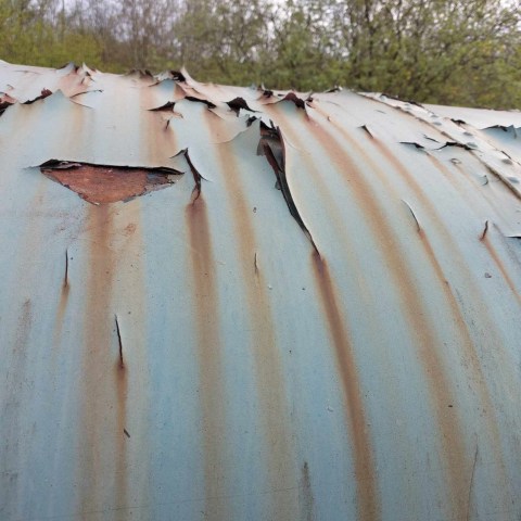 a group of men walking down a dirt road