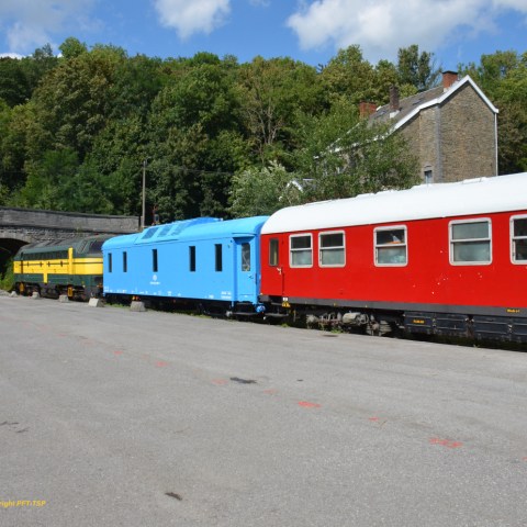 a train is parked on the side of a road