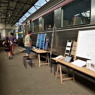 a group of people sitting at a train station