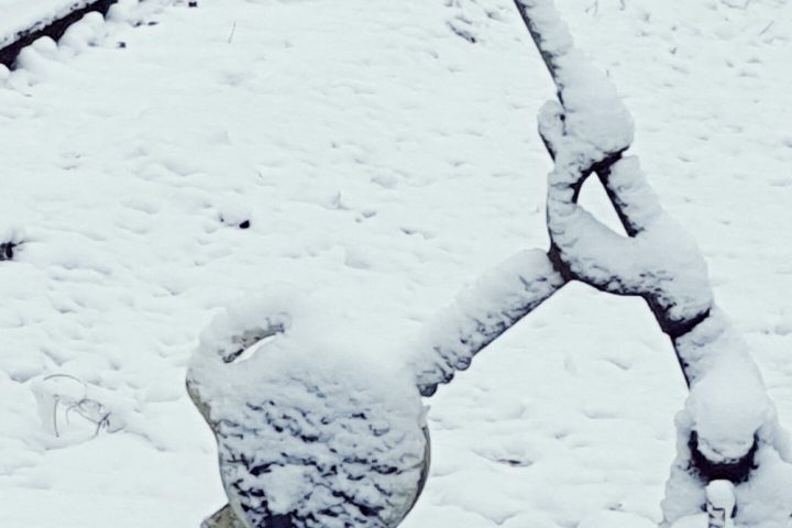 a man riding skis down a snow covered slope