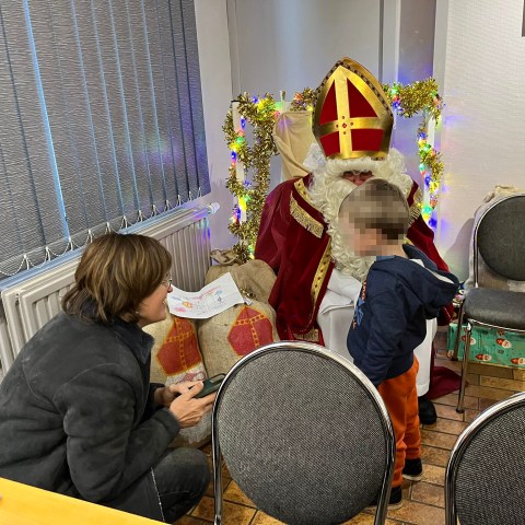a group of people sitting in a chair