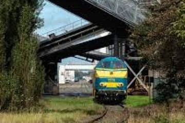 a train is parked on the side of a road