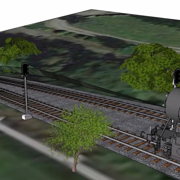 3D model of a green steam train on tracks with trees and a signal light.