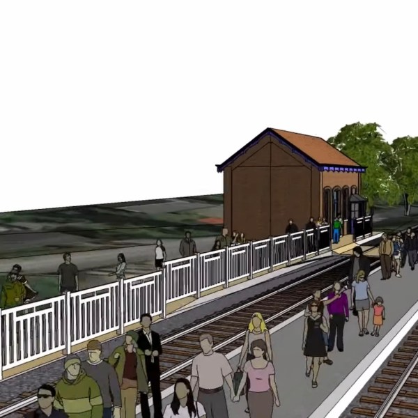 Illustration of people walking on a train station platform beside tracks and a small brick building.