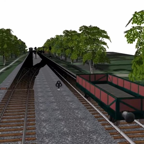 Animation of train tracks with trees and open freight car in foreground.