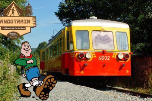 Red and yellow train on tracks with hiking cartoon and 'Randotrain' logo.